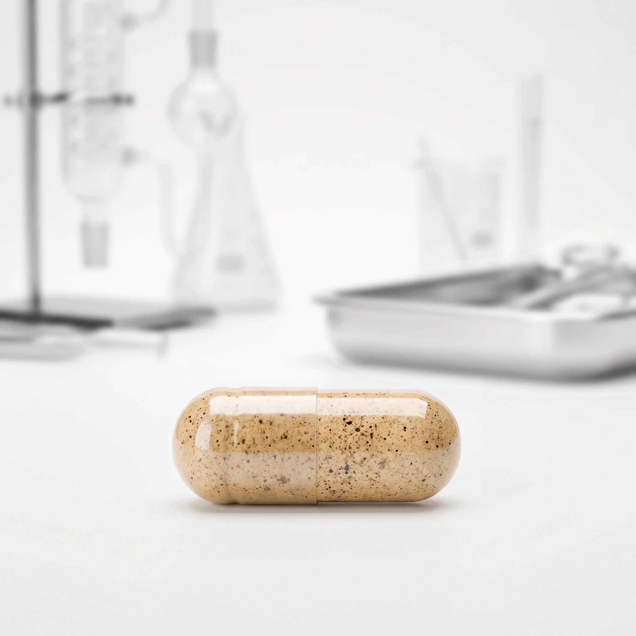 BioMatrix clinical capsule next to a polished laboratory surface.
